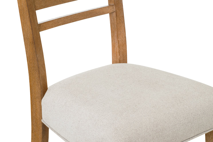 Wooden chair with a beige cushion on a white background
